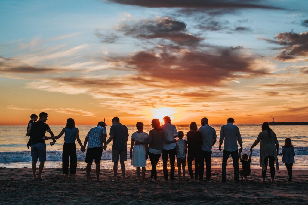 Family in the beach at sunset - Letters from Feisal March 2022